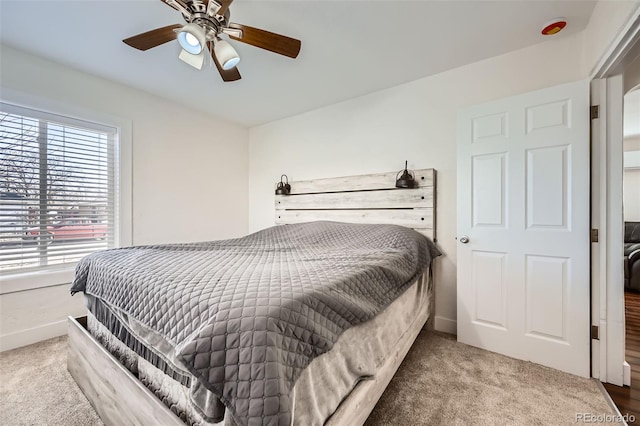 bedroom with ceiling fan and carpet floors