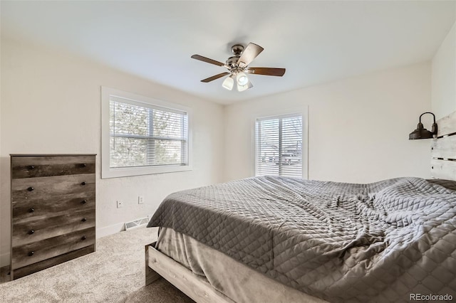 bedroom with ceiling fan and carpet floors