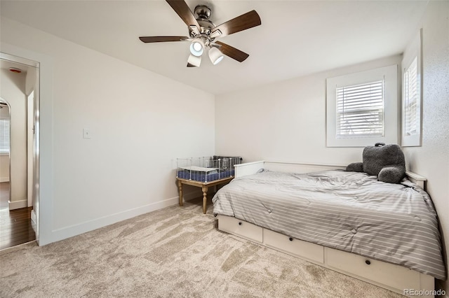 bedroom with ceiling fan and carpet flooring