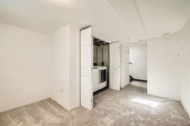 interior space featuring light carpet and a textured ceiling