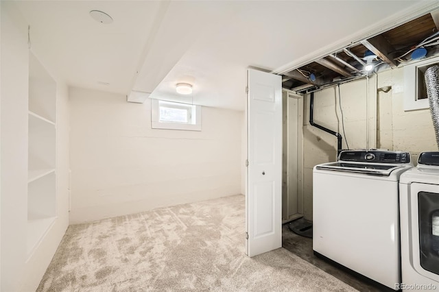 laundry room featuring separate washer and dryer and carpet flooring