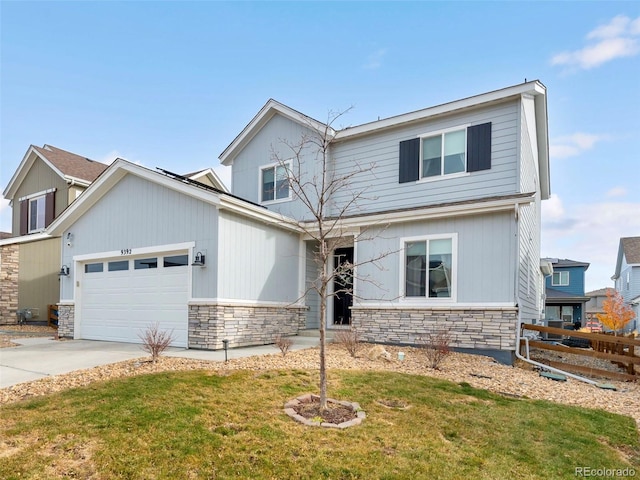 view of front of home with a garage and a front lawn