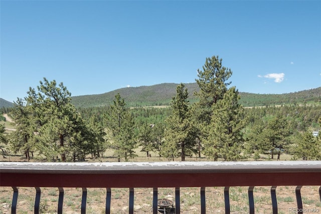 3126 Singletree Rd, Hartsel, CO 80449 - view of mountain backdrop with a forest