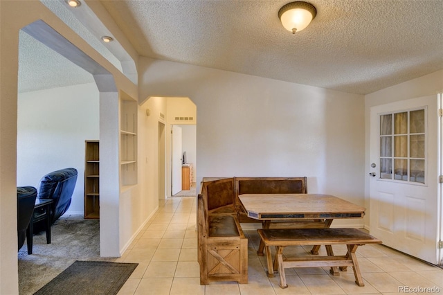 3126 Singletree Rd, Hartsel, CO 80449 - dining space with a textured ceiling, light tile patterned flooring, and arched walkways