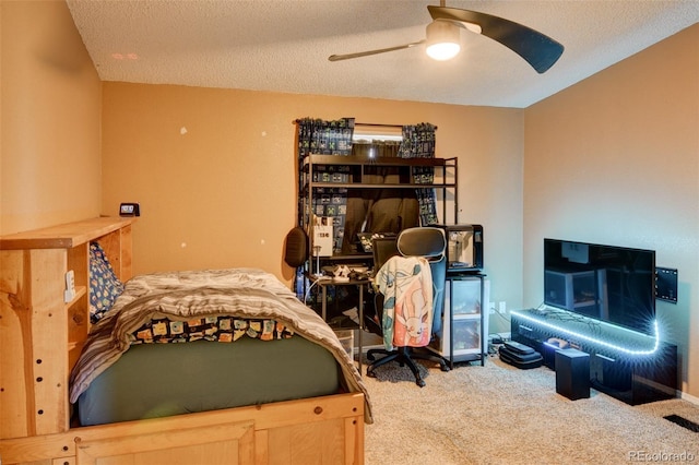 3126 Singletree Rd, Hartsel, CO 80449 - bedroom featuring carpet floors, a textured ceiling, and a ceiling fan