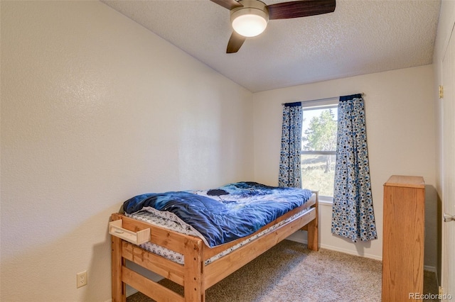 3126 Singletree Rd, Hartsel, CO 80449 - carpeted bedroom with a textured ceiling and a ceiling fan
