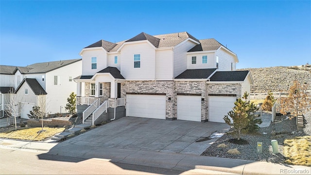 view of front of house featuring stairs, an attached garage, stone siding, and driveway