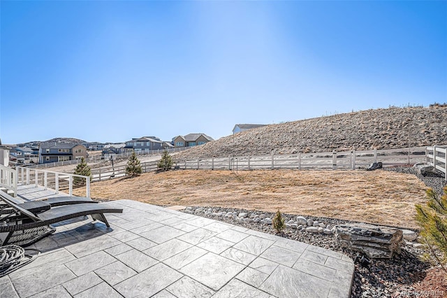 view of patio with a residential view and a fenced backyard