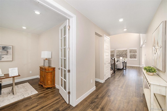 hall with dark wood-type flooring, recessed lighting, and baseboards