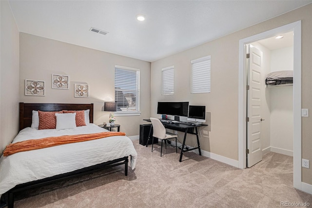 bedroom featuring light carpet, visible vents, and baseboards