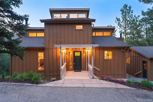 207 Kelly Rd E, Boulder, CO 80302 - view of front of house featuring roof with shingles and board and batten siding