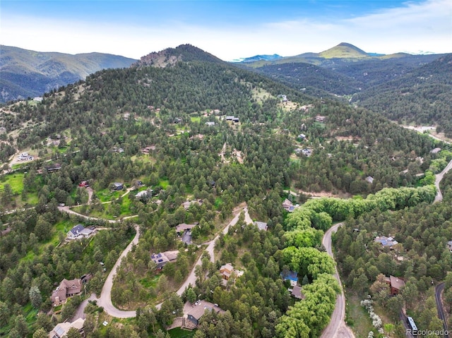 207 Kelly Rd E, Boulder, CO 80302 - drone / aerial view of mountains and a heavily wooded area
