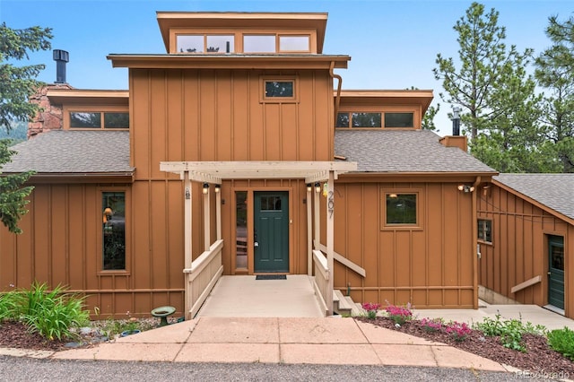 207 Kelly Rd E, Boulder, CO 80302 - view of front of property with roof with shingles and board and batten siding