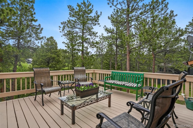 207 Kelly Rd E, Boulder, CO 80302 - wooden terrace featuring view of wooded area