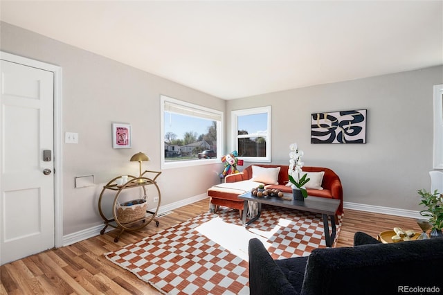 office area featuring baseboards and light wood-type flooring