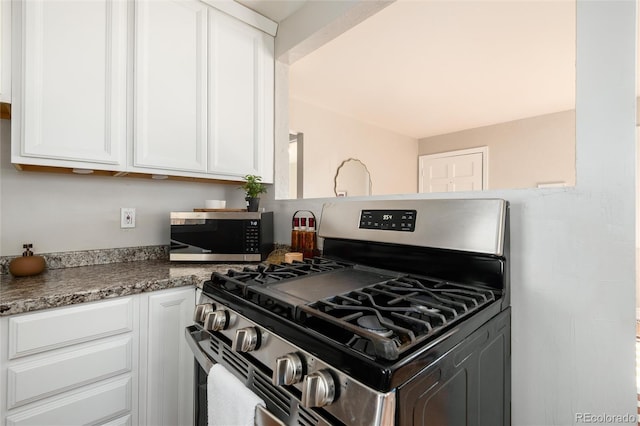 kitchen featuring white cabinetry and appliances with stainless steel finishes