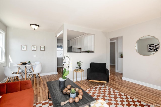 living room featuring light wood-style floors and baseboards