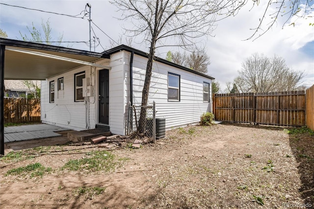 exterior space featuring a fenced backyard and central air condition unit