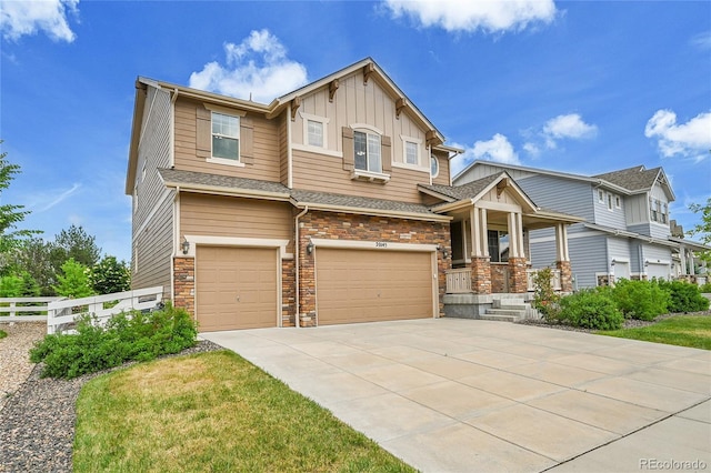 20145 E Fair Ln, Centennial, CO 80016 - craftsman-style home featuring an attached garage, board and batten siding, driveway, and stone siding