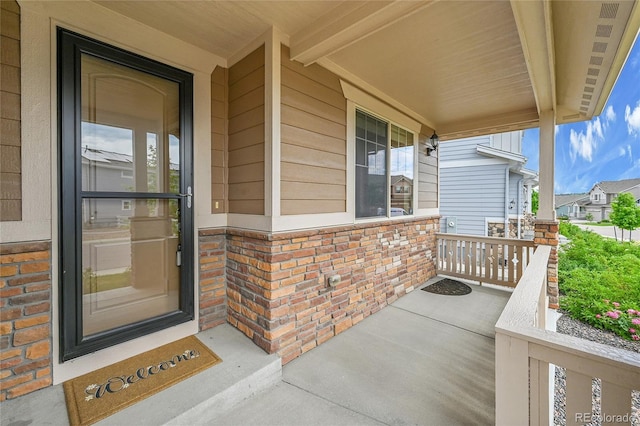 20145 E Fair Ln, Centennial, CO 80016 - view of exterior entry with a porch and brick siding