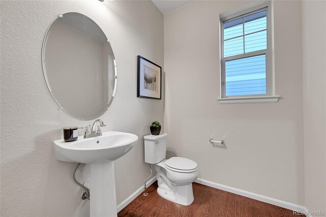 20145 E Fair Ln, Centennial, CO 80016 - half bath featuring baseboards and wood finished floors