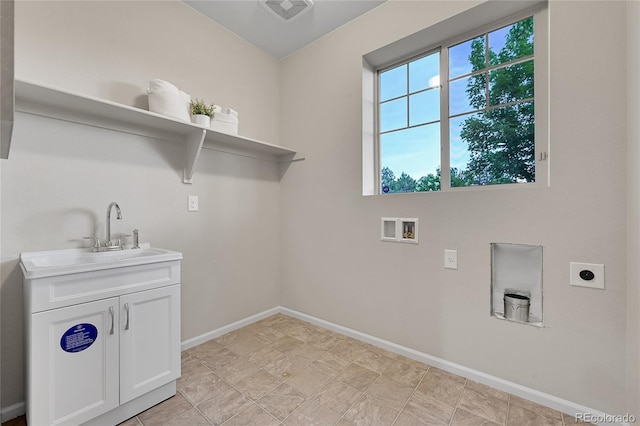 20145 E Fair Ln, Centennial, CO 80016 - laundry room with electric dryer hookup, cabinet space, and washer hookup