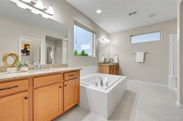 20145 E Fair Ln, Centennial, CO 80016 - full bathroom with two vanities, a garden tub, and tile patterned flooring