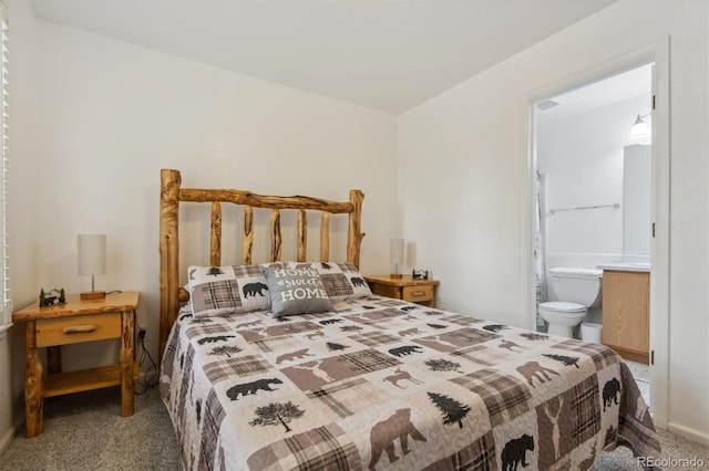 carpeted bedroom with ensuite bathroom