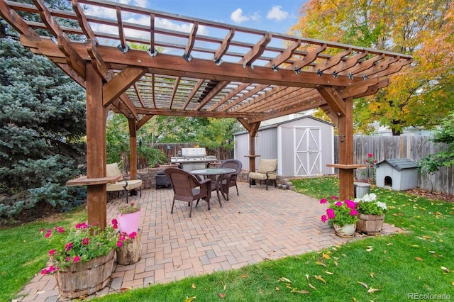 view of patio / terrace featuring a pergola and a storage unit