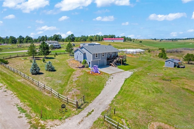 birds eye view of property featuring a rural view