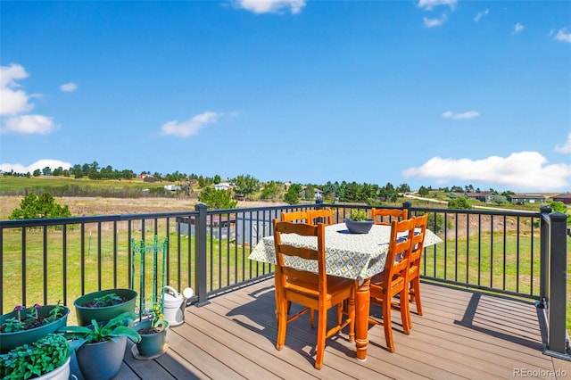 wooden deck featuring a yard