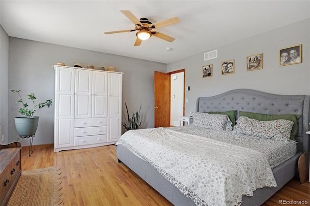 bedroom with ceiling fan and light hardwood / wood-style floors