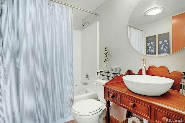 full bathroom featuring shower / bath combination with curtain, vanity, and toilet