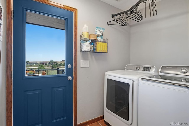 washroom featuring washing machine and clothes dryer and tile patterned flooring