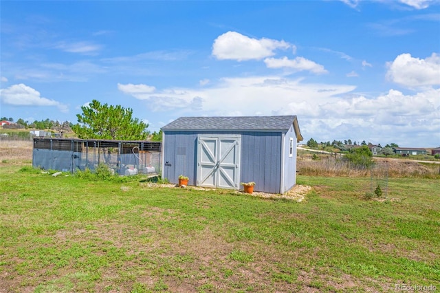 view of outdoor structure featuring a yard