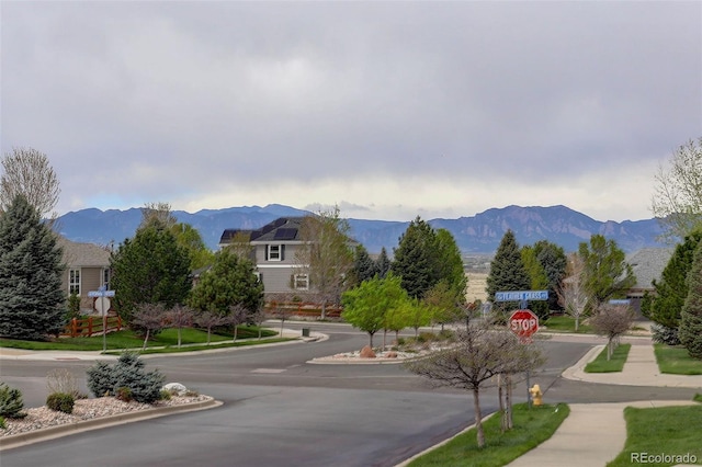 4784 Raven Run, Broomfield, CO 80023 - view of road with sidewalks, a mountain view, traffic signs, and curbs