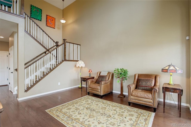4784 Raven Run, Broomfield, CO 80023 - living area featuring baseboards, a high ceiling, stairs, and wood finished floors