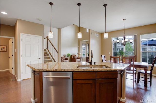 4784 Raven Run, Broomfield, CO 80023 - kitchen featuring stainless steel dishwasher, pendant lighting, baseboards, dark wood-type flooring, and a sink