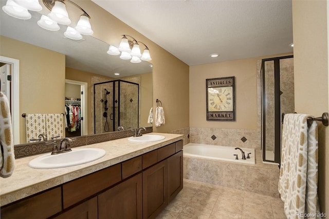4784 Raven Run, Broomfield, CO 80023 - bathroom featuring a sink, a walk in closet, a shower stall, and a garden tub