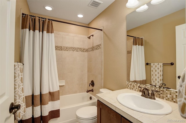 4784 Raven Run, Broomfield, CO 80023 - full bathroom with visible vents, vanity, a textured wall, toilet, and shower / bathtub combination with curtain