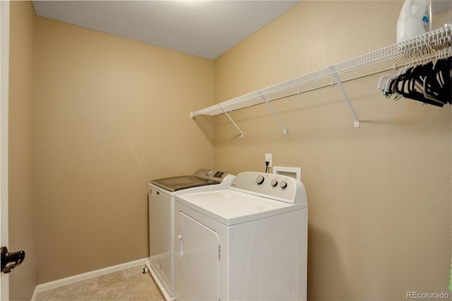 4784 Raven Run, Broomfield, CO 80023 - laundry area with baseboards, laundry area, and washer and clothes dryer