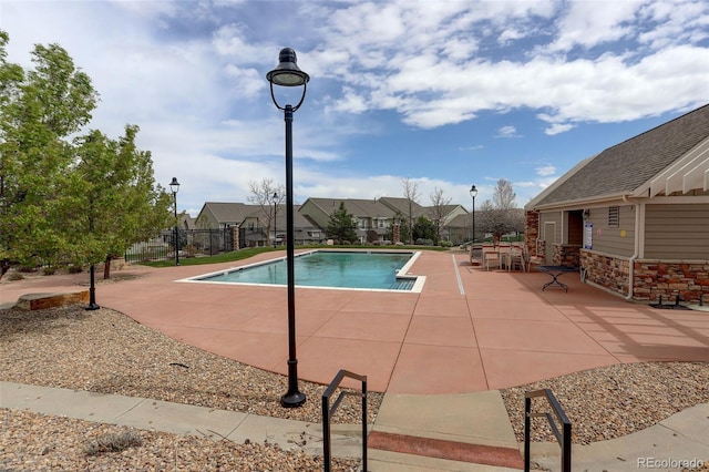 4784 Raven Run, Broomfield, CO 80023 - pool with a patio, fence, and a residential view
