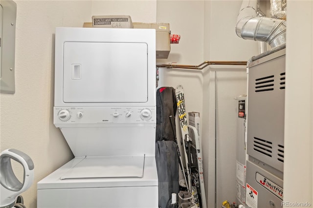 laundry area featuring laundry area and stacked washer / drying machine