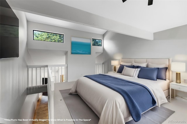 bedroom with beam ceiling, hardwood / wood-style flooring, and ceiling fan