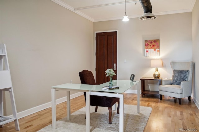 home office with ornamental molding and light wood-type flooring