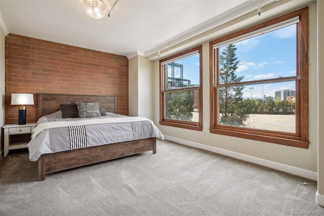 bedroom with crown molding and carpet floors