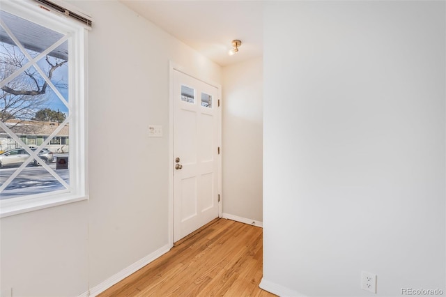 doorway featuring a wealth of natural light and light wood-type flooring