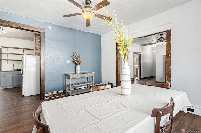 dining area featuring ceiling fan and wood finished floors
