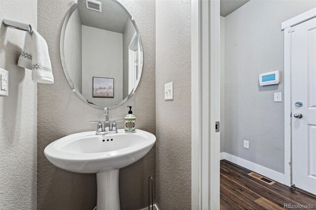 bathroom featuring wood-type flooring