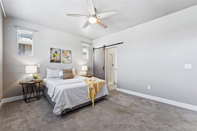 bedroom featuring carpet floors, a barn door, and ceiling fan